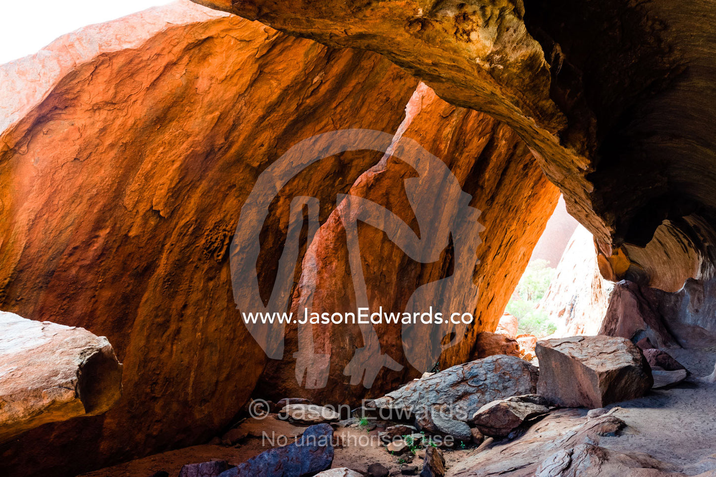 A sandstone cave at the base of Uluru provided shelter for Aboriginal people. Uluru Kata Tjuta National Park, Northern Territory, Australia.