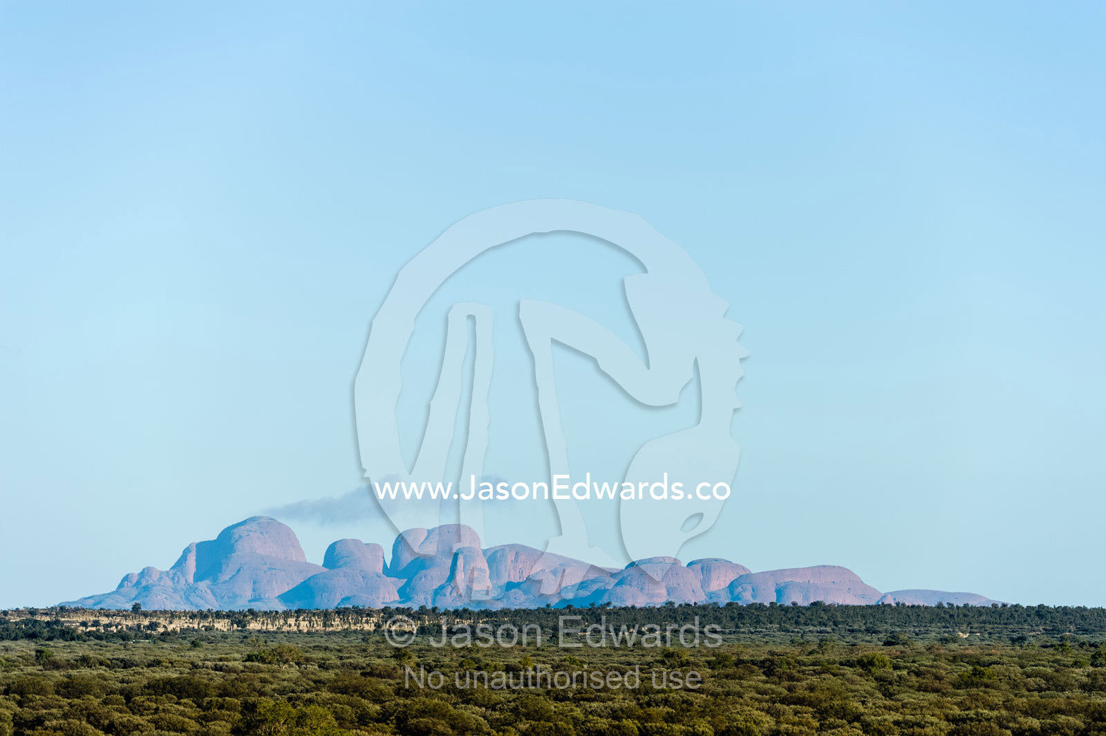 The domes of Kata Tjuta on the distant horizon of the desert plain. Uluru Kata Tjuta National Park, Northern Territory, Australia.