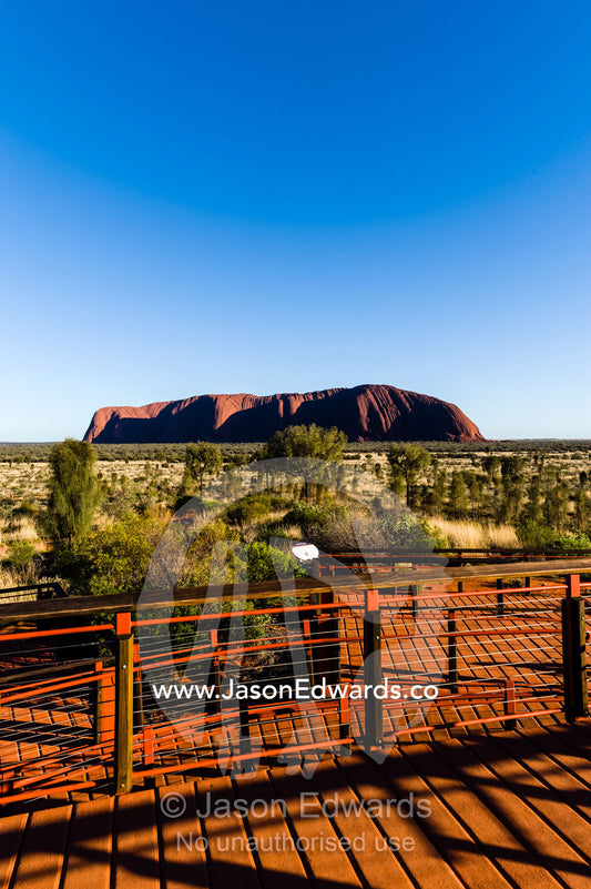 Viewing platforms give tourists an opportunity to see above the desert plain to Uluru. Uluru Kata Tjuta National Park, Northern Territory, Australia.