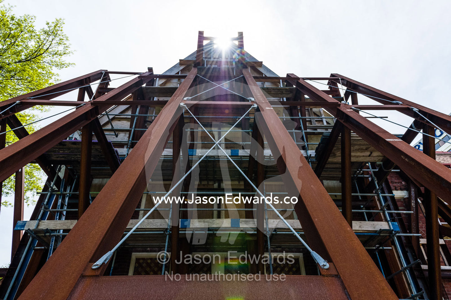 Steel girders support the facade of building damaged in an earthquake. Christchurch, South Island, New Zealand.