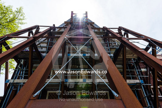 Steel girders support the facade of building damaged in an earthquake. Christchurch, South Island, New Zealand.