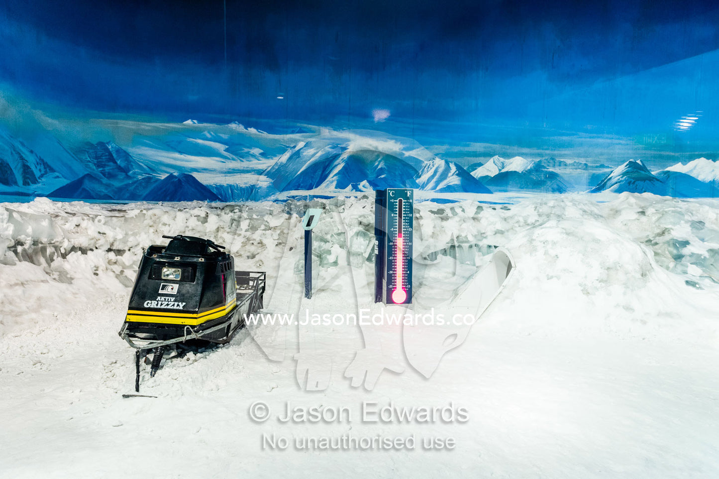 A skidoo and a thermometer in a refrigerated room that replicates Antarctic weather conditions. International Antarctic Centre, Harewood, Christchurch, South Island, New Zealand.
