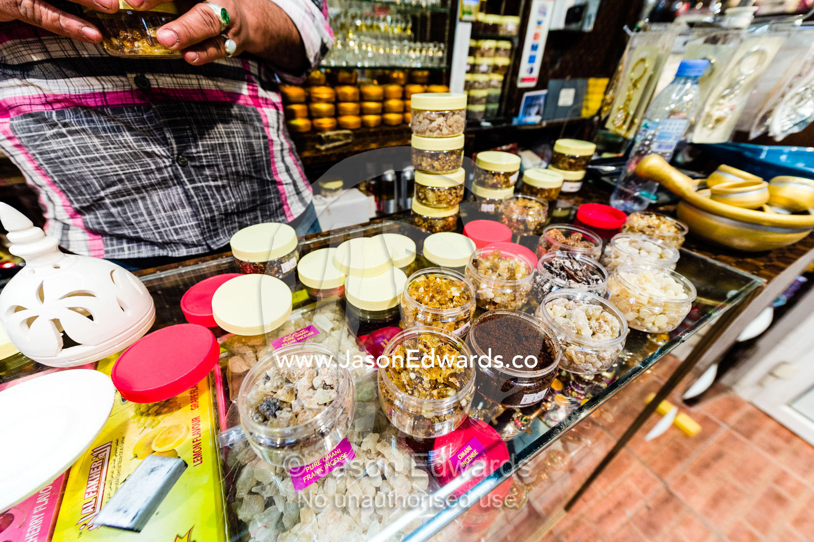 A shop in a market displays and sells varieties of aromatic frakincense. Muscat, Sultanate of Oman.