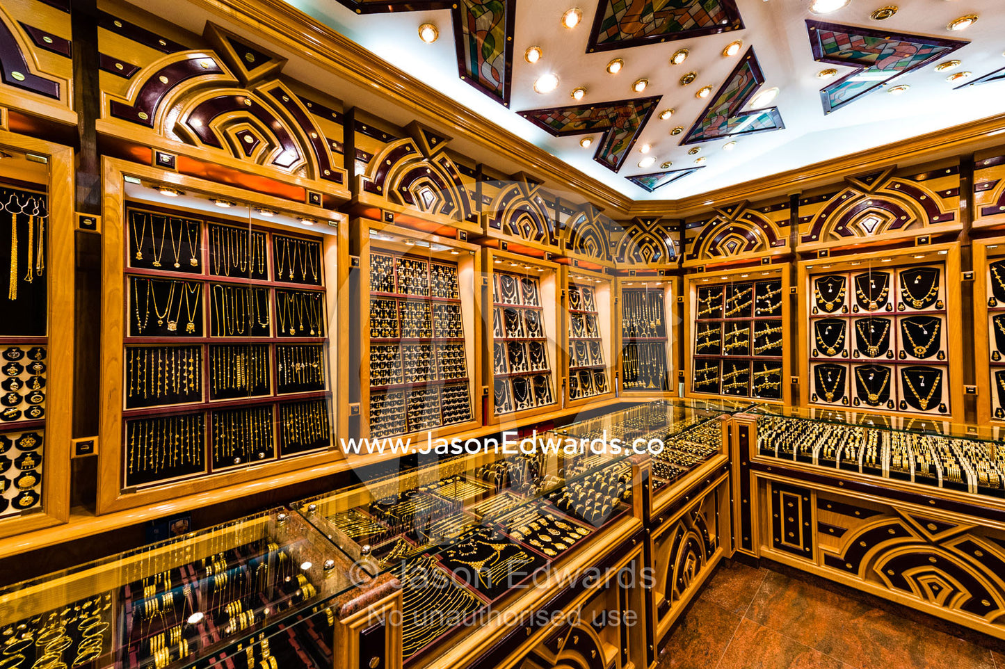A shop in a market displays and sells varieties of gold bracelets and jewellery. Mutrah Souq, Muscat, Sultanate of Oman.