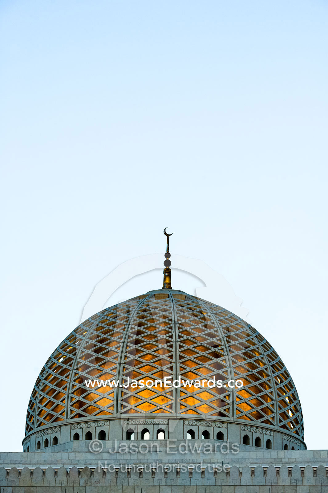 A crescent moon sits atop the dome of the Prayer Hall in the Grand Mosque in Muscat. Sultan Qaboos Grand Mosque, Muscat, Sultanate of Oman.