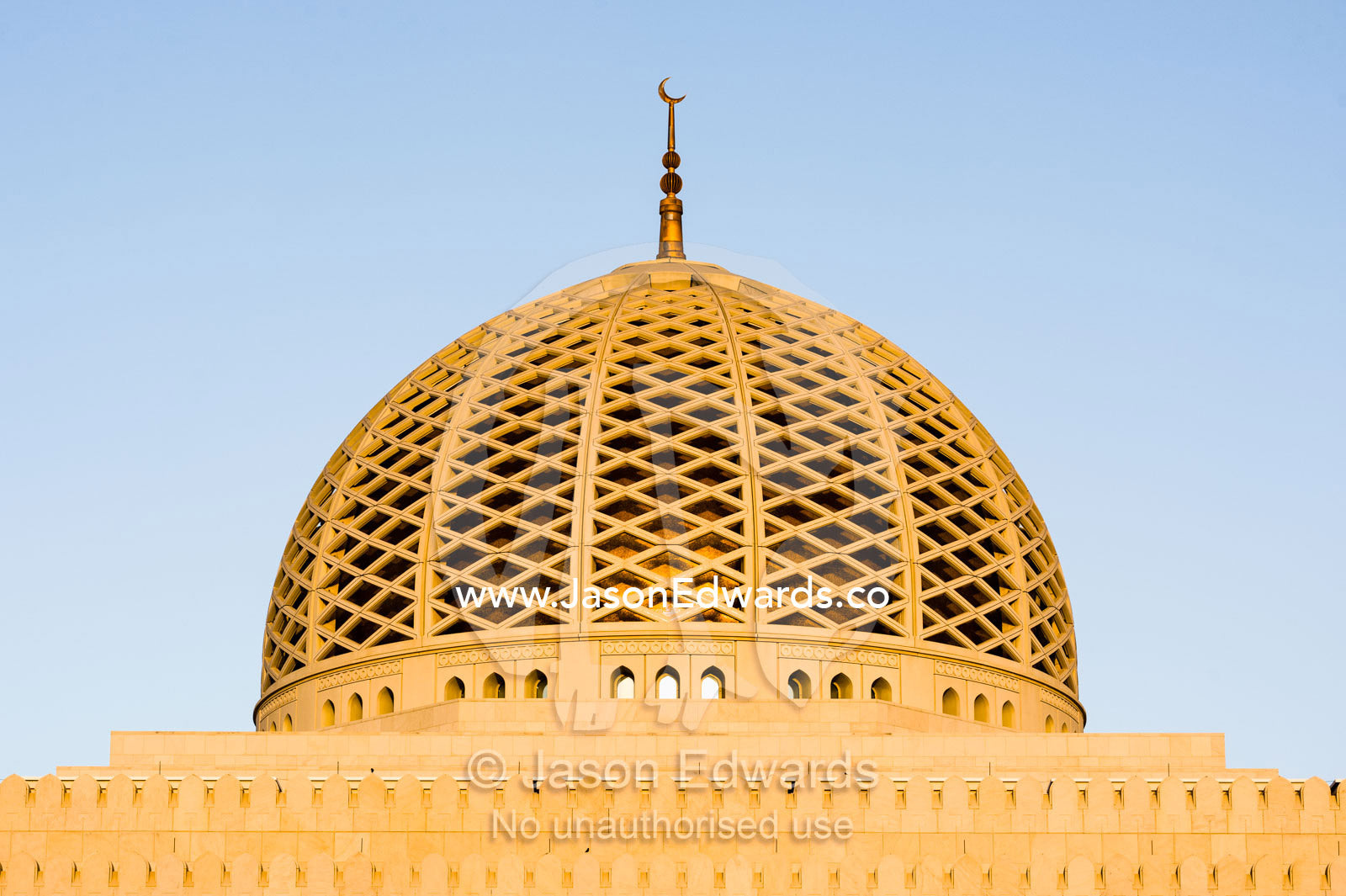 A crescent moon sits atop the dome of the Prayer Hall in the Grand Mosque in Muscat. Sultan Qaboos Grand Mosque, Muscat, Sultanate of Oman.
