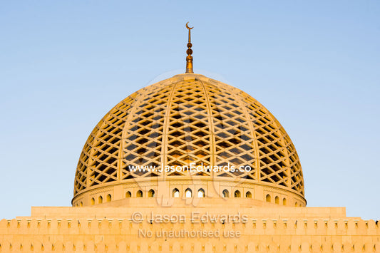 A crescent moon sits atop the dome of the Prayer Hall in the Grand Mosque in Muscat. Sultan Qaboos Grand Mosque, Muscat, Sultanate of Oman.