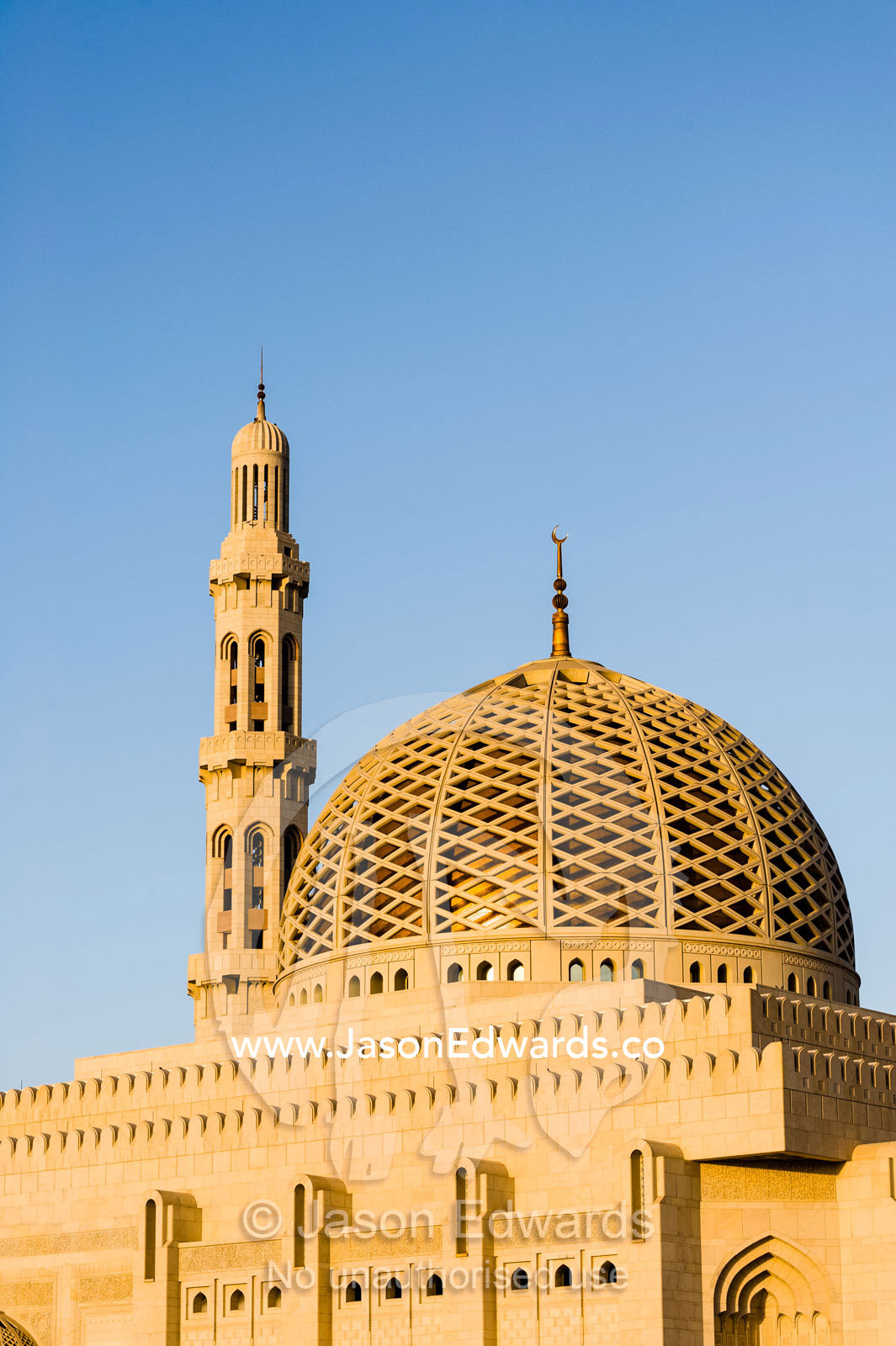 A crescent moon sits atop the dome of the Prayer Hall in the Grand Mosque in Muscat. Sultan Qaboos Grand Mosque, Muscat, Sultanate of Oman.