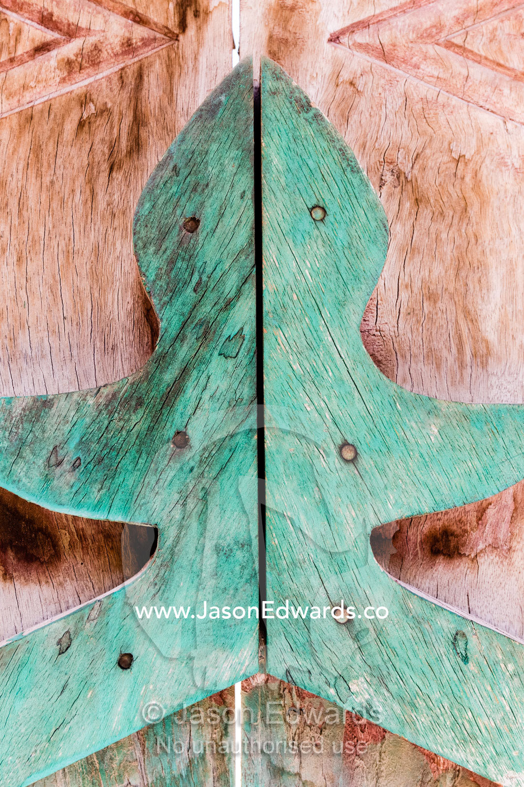 Carved timber door handles of a home in an ancient desert village. Ibra, Ash Sharqiyah Region, Sultanate of Oman.