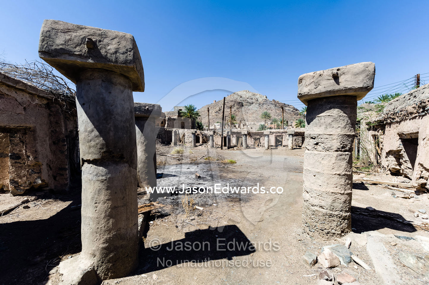 Large columns once supported the roof of a market in an abandoned ancient village. Ibra, Ash Sharqiyah Region, Sultanate of Oman.