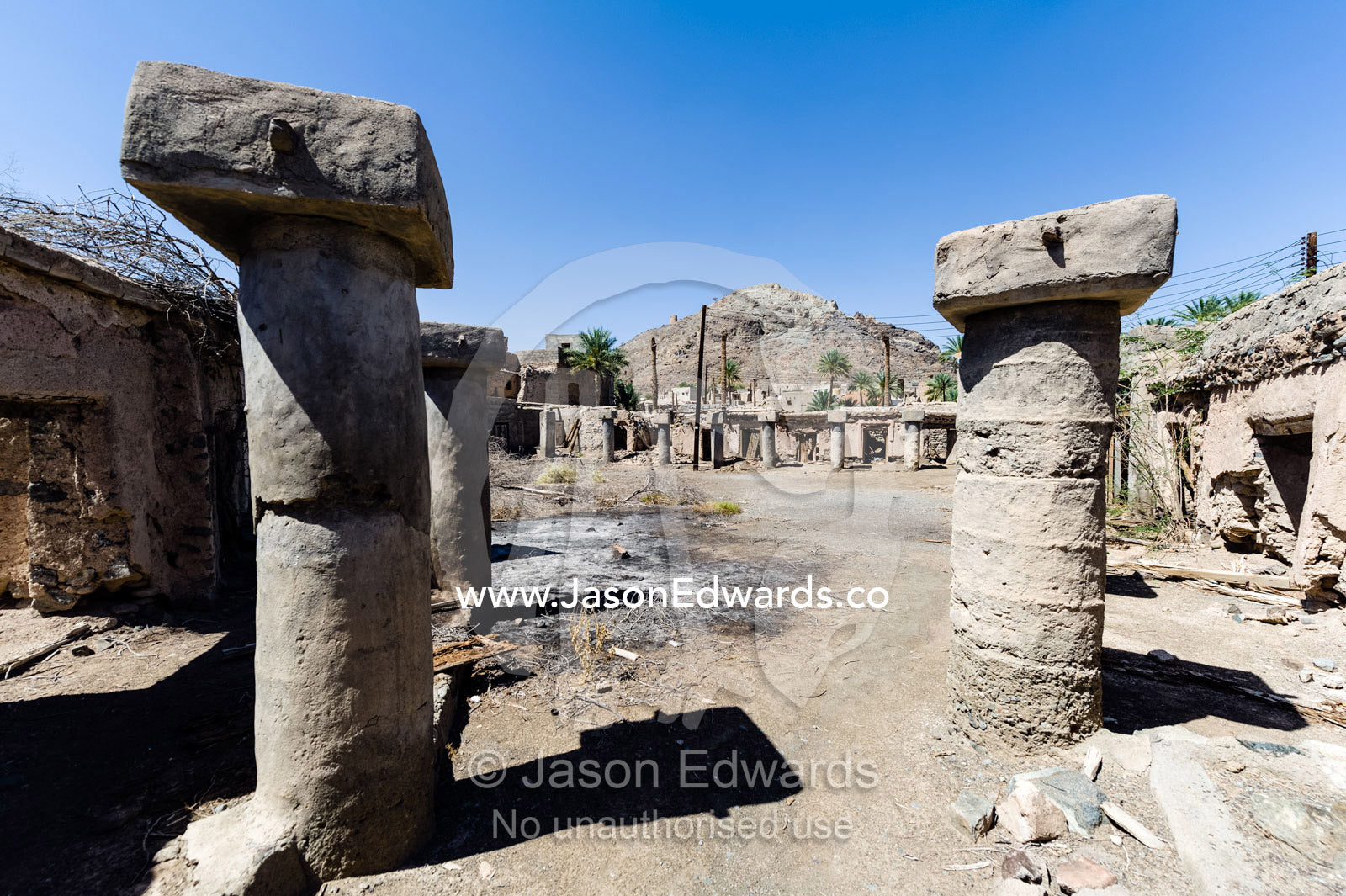 Large columns once supported the roof of a market in an abandoned ancient village. Ibra, Ash Sharqiyah Region, Sultanate of Oman.