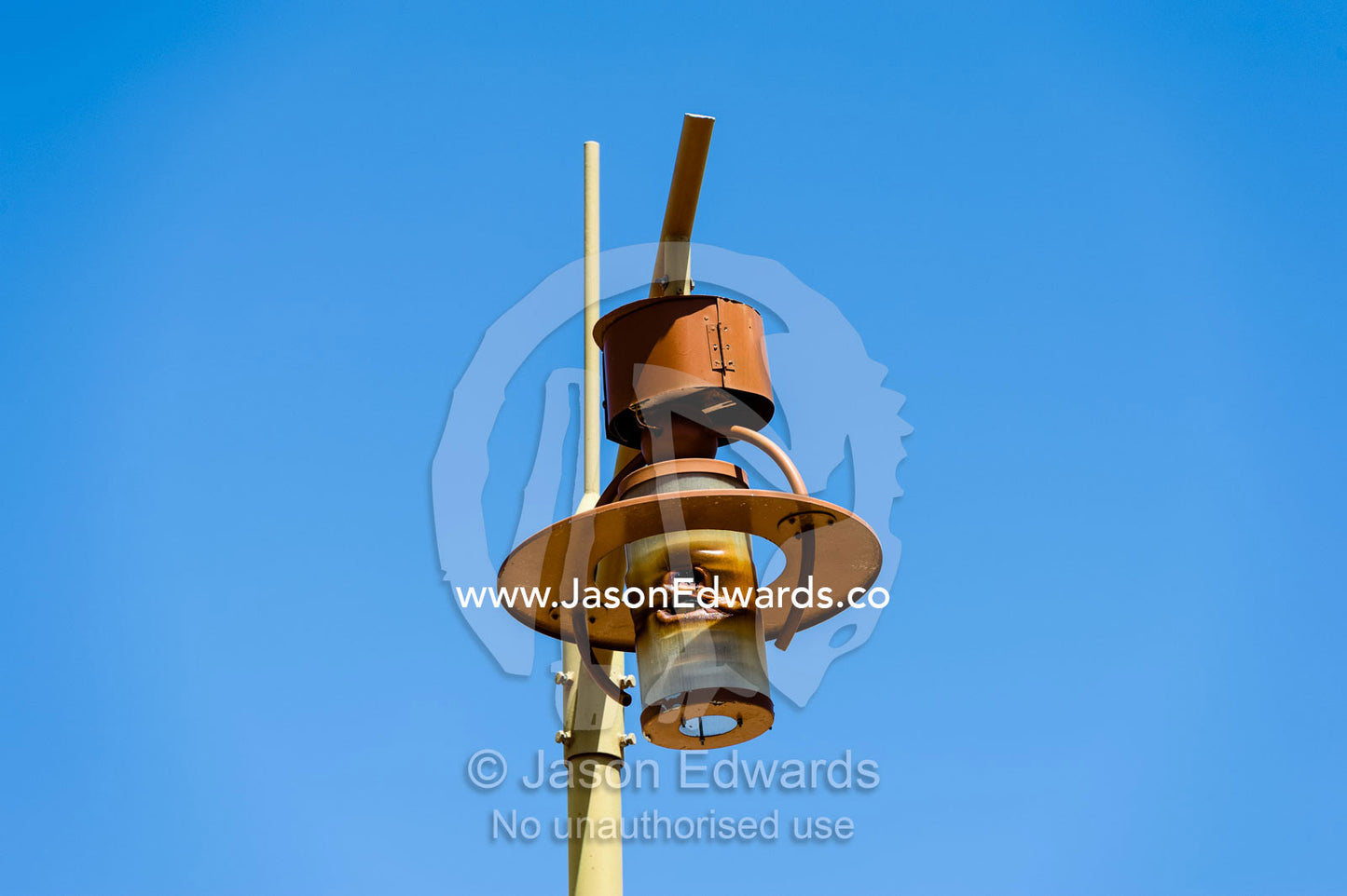 An antique rusting lantern atop a light pole in an abandoned village. Ibra, Ash Sharqiyah Region, Sultanate of Oman.
