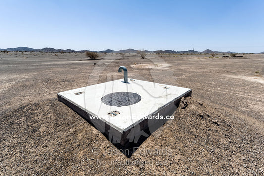 A well marker indicates where water is close to the desert surface in an aquaduct. Nizwa, Sultanate of Oman.