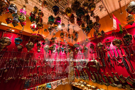 A display of silver bracelets, necklaces, jewellery and khanjar knives for sale in a souq. Mutrah Souq, Muscat, Sultanate of Oman.