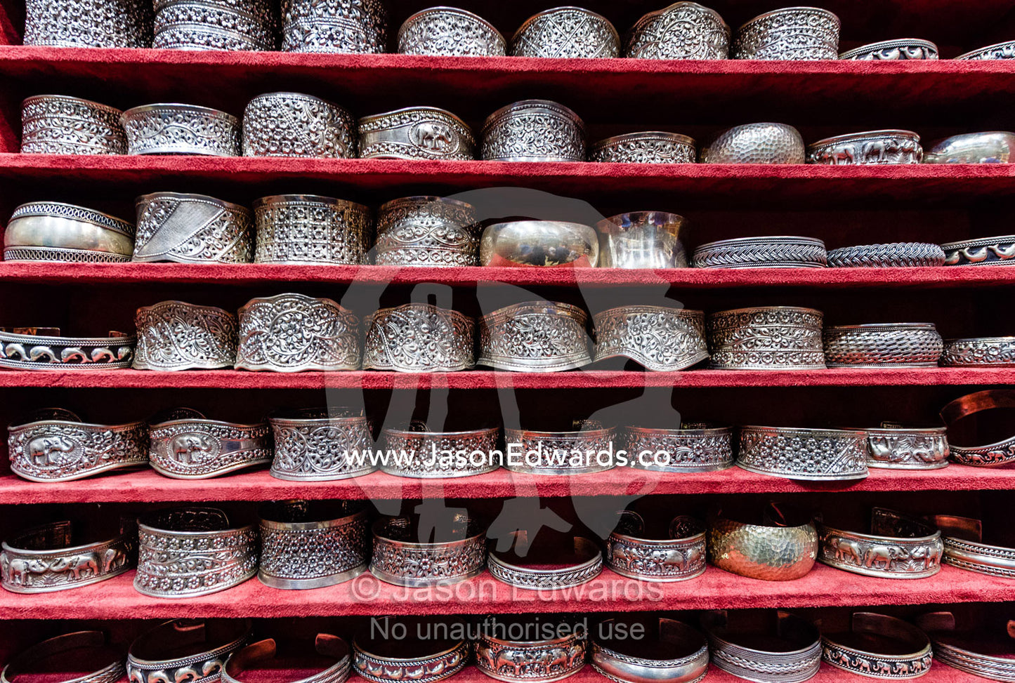A display of silver bracelets for sale in a souq. Mutrah Souq, Muscat, Sultanate of Oman.