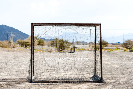 Wornout football nets on a dusty desert field. Jabrin Fort, Ad Dakhiliyah Governorate, Sultanate of Oman.