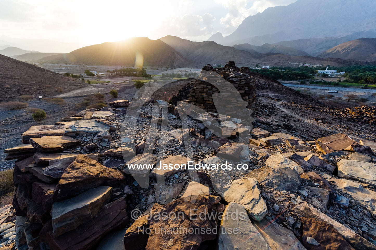 Ancient handmade stone burial mounds and tombs atop a desert ridge. Archaeological Sites of Bat, Al-Ayn, Al Dhahira Region, Sultanate of Oman.