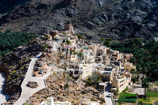 A mountain village stacked on terraced streets in a desert mountain valley. Balad Sayt, Wadi Bani Awf, Snake Gorge, Western Hajar Mountains, Ad Dakhiliyah Region, Sultanate of Oman.