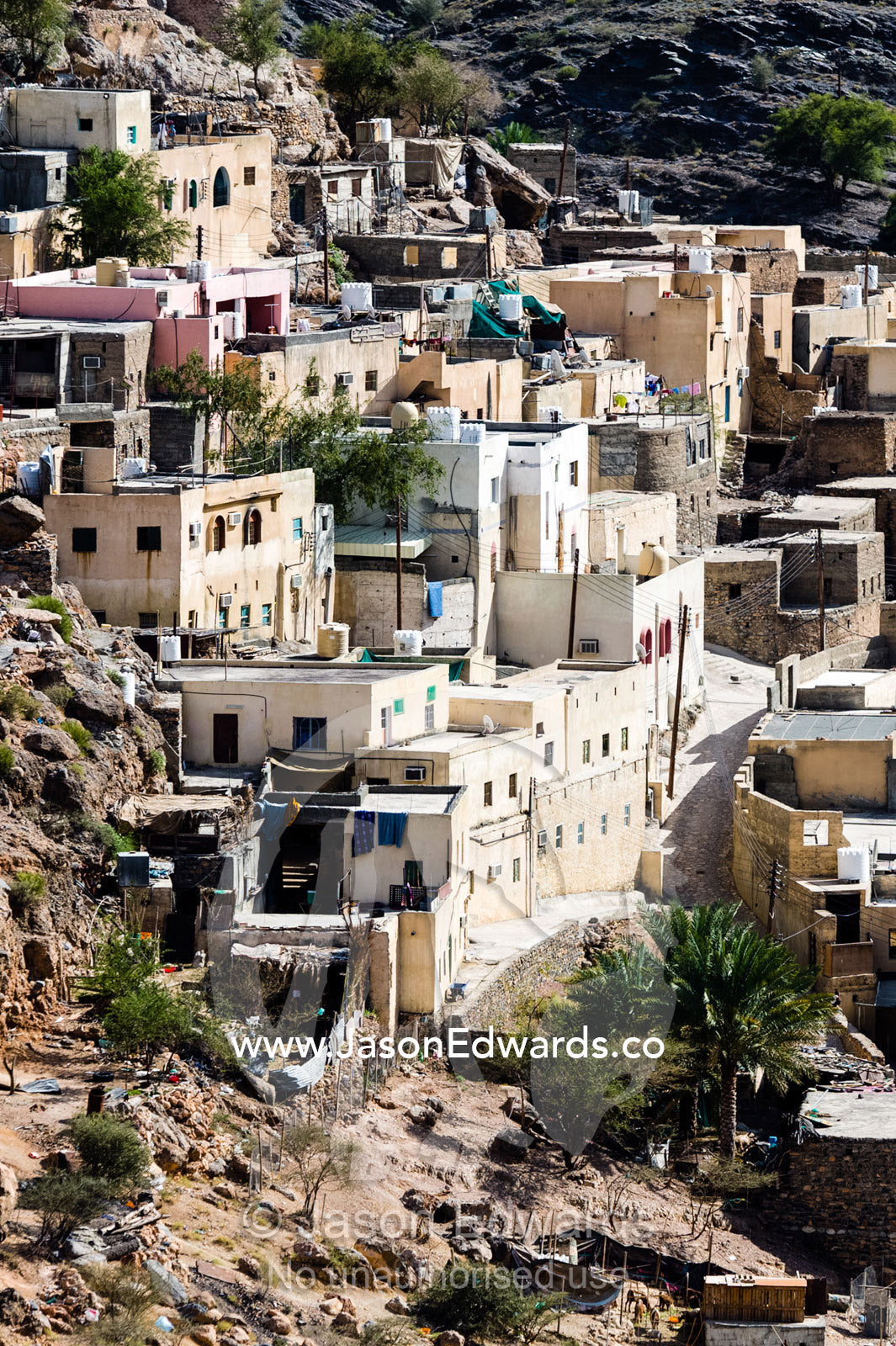 A mountain village stacked on terraced streets in a desert mountain valley. Balad Sayt, Wadi Bani Awf, Snake Gorge, Western Hajar Mountains, Ad Dakhiliyah Region, Sultanate of Oman.