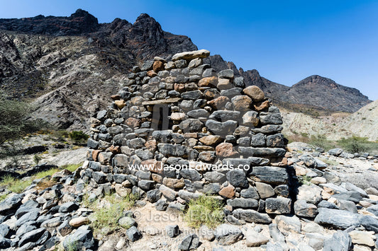 The ruins of a handmade stone house in an arid desert valley. Wadi Bani Awf, Snake Gorge, Western Hajar Mountains, Ad Dakhiliyah Region, Sultanate of Oman.