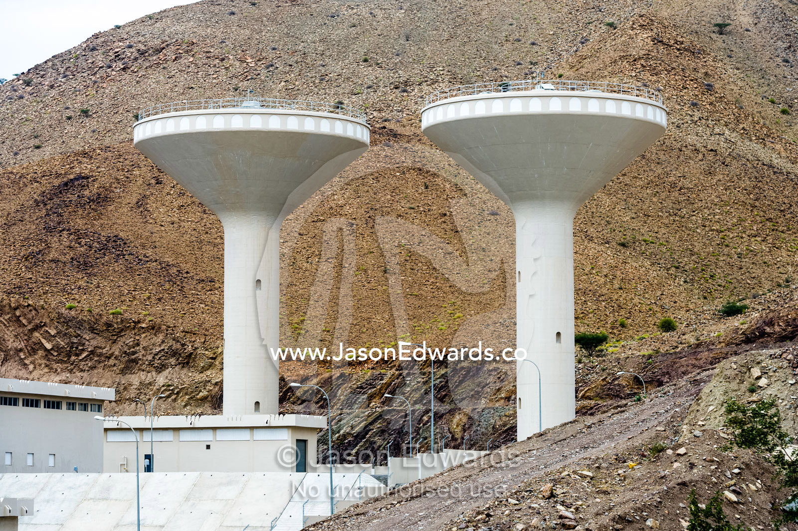 A water catchment dam in a desert valley provides water for a nearby town. Dima Wal Taeen, North Al Sharqiyah Governorate, Sultanate of Oman.