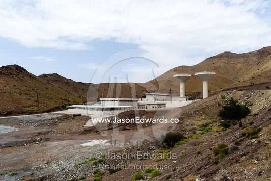 A water catchment dam in a desert valley provides water for a nearby town. Dima Wal Taeen, North Al Sharqiyah Governorate, Sultanate of Oman.