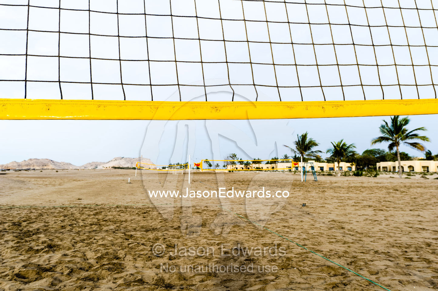 A volleyball net on an empty beach on the Gulf of Oman. Daymaniyat Islands Nature Reserve, Wilayat AlSeeb, Barka, Sultanate of Oman.