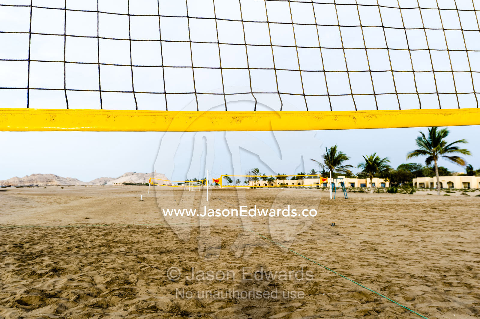 A volleyball net on an empty beach on the Gulf of Oman. Daymaniyat Islands Nature Reserve, Wilayat AlSeeb, Barka, Sultanate of Oman.