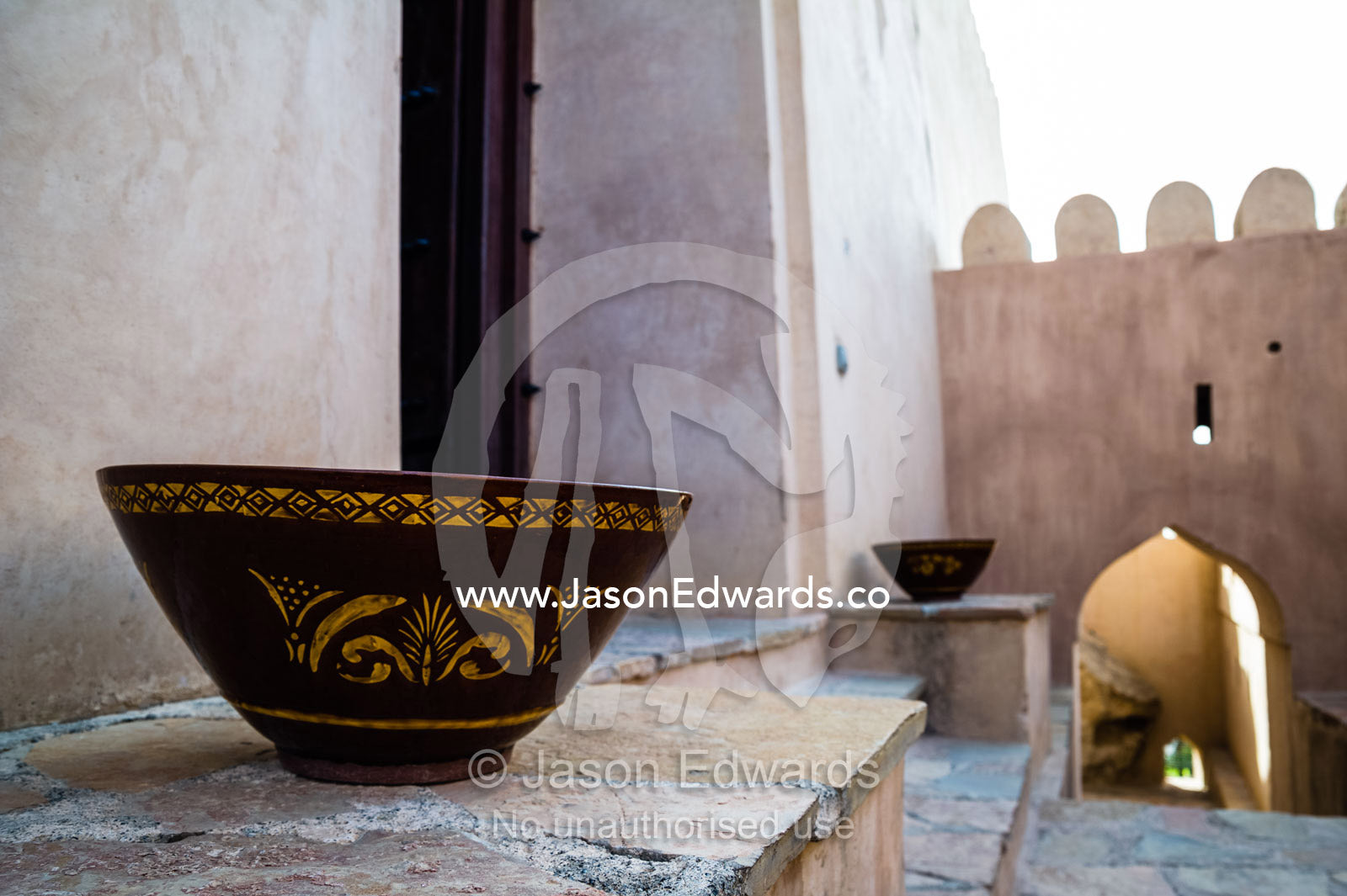 A decorated bowl on a step in an ancient fort. Nakhal Fort, Wilayt Nakhal, Mount Nakhal, Al Batinah South Governorate, Sultanate of Oman.