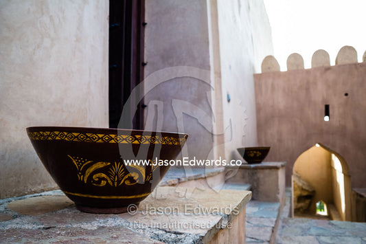 A decorated bowl on a step in an ancient fort. Nakhal Fort, Wilayt Nakhal, Mount Nakhal, Al Batinah South Governorate, Sultanate of Oman.