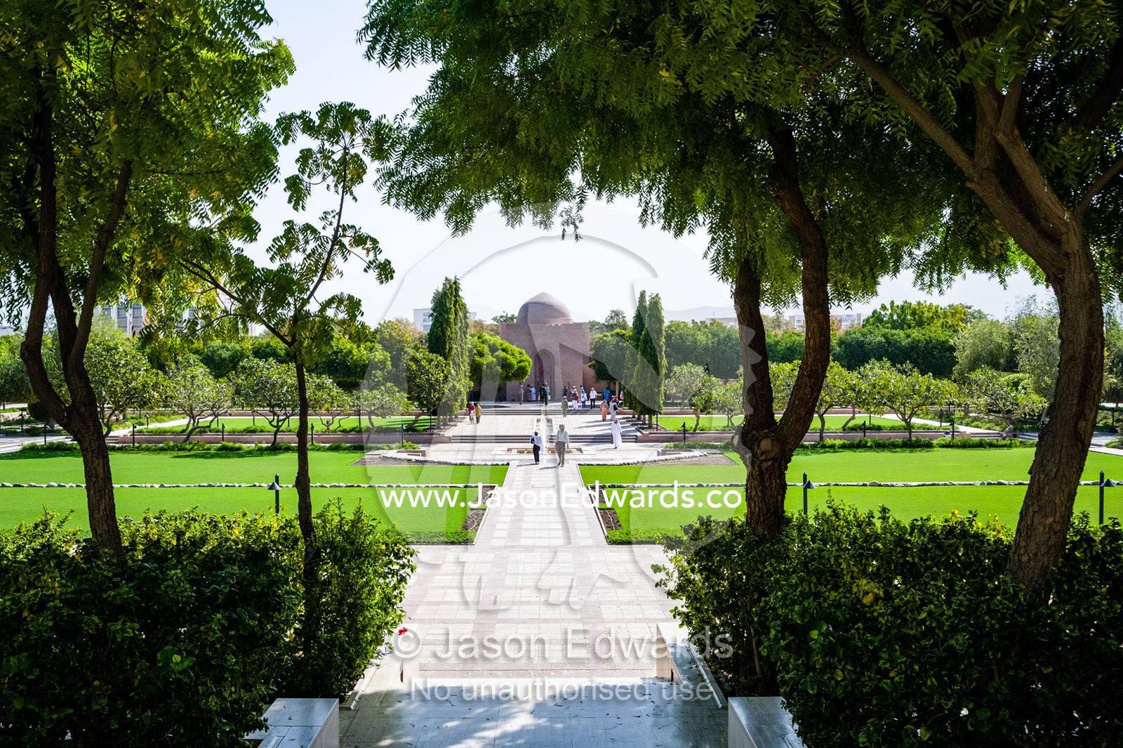 Lush, peaceful gardens and shady trees surround the Grand Mosque in Oman. Sultan Qaboos Grand Mosque, Muscat, Sultanate of Oman.