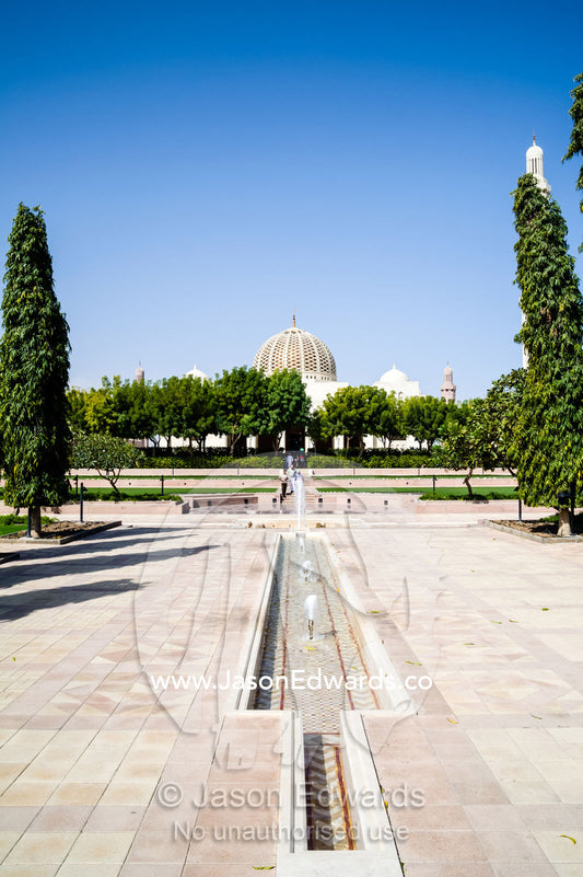 Fountains and aqueducts dissect the lush gardens surrounding the Grand Mosque. Sultan Qaboos Grand Mosque, Muscat, Sultanate of Oman.