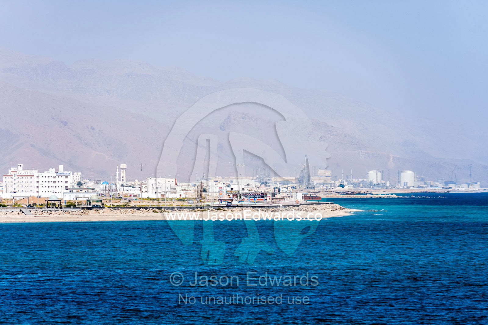 The white walls and architecture of a coastal town on the shores of the Gulf of Oman. Sur, Ash Sharqiyah Region, Gulf of Oman, Sultanate of Oman.