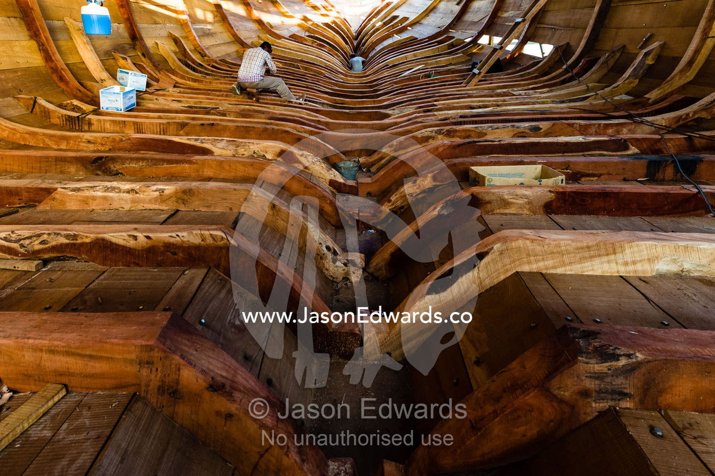 The timber ribs of a wooden dhow hold the planks of the hull in place during construction. Sur, Ash Sharqiyah Region, Gulf of Oman, Sultanate of Oman.