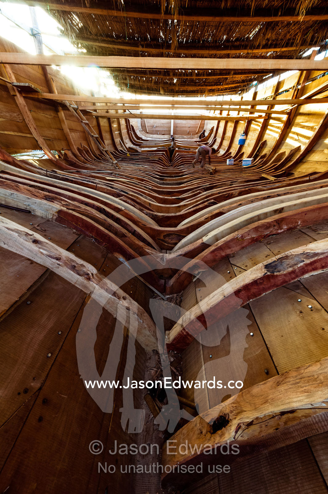 The timber ribs of a wooden dhow hold the planks of the hull in place during construction. Sur, Ash Sharqiyah Region, Gulf of Oman, Sultanate of Oman.