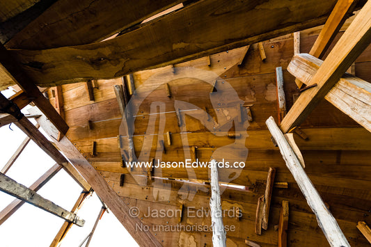During construction of a dhow, the planks of the hull are held with wooden plugs and scaffolding. Sur, Ash Sharqiyah Region, Gulf of Oman, Sultanate of Oman.