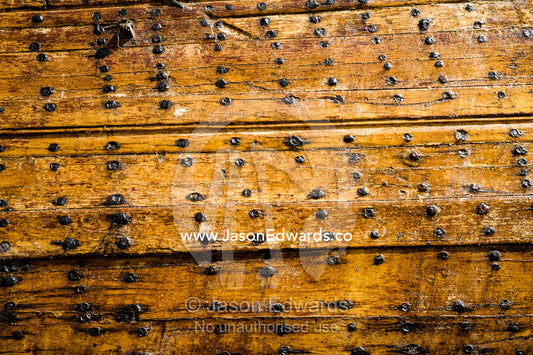 Lacquered nails and planks seal the hull of Fateh al-Khair, the last surviving dhow of the pre-oil era. Sur, Ash Sharqiyah Region, Gulf of Oman, Sultanate of Oman.