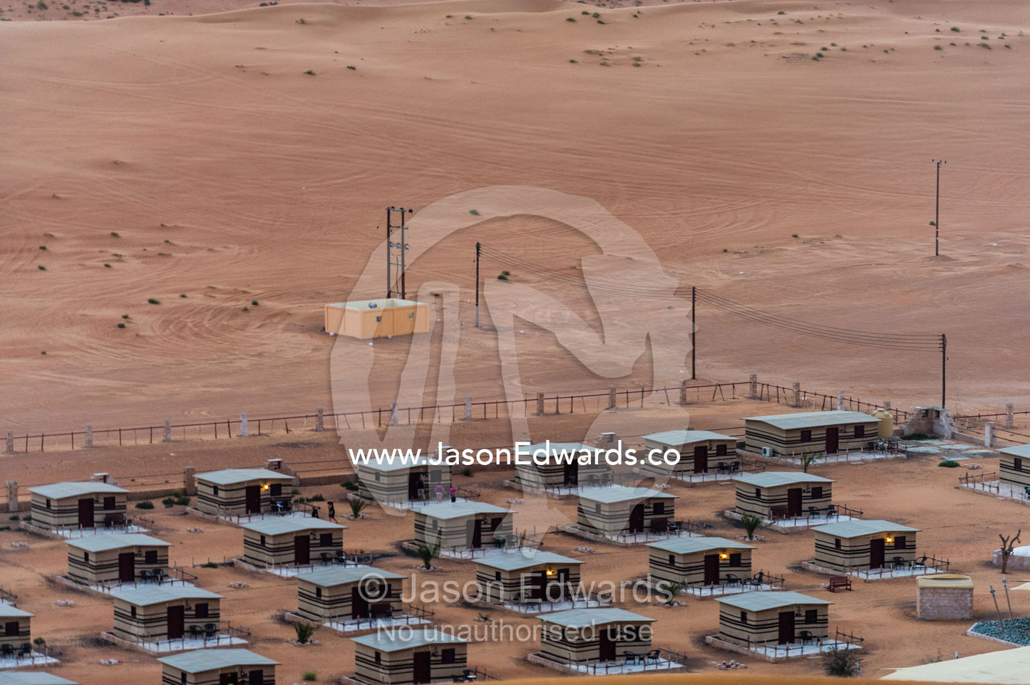 Accommodation at a desert camp resting between two sand dunes. Wahiba Sands, Ramlat al-Wahiba, Sharqiya Sands, Sultanate of Oman.
