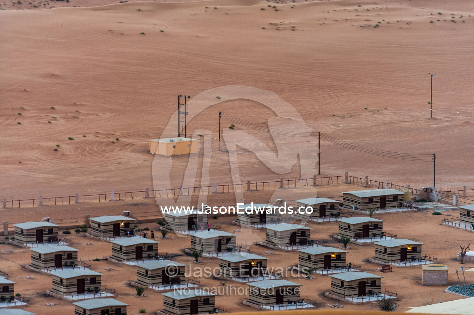 Accommodation at a desert camp resting between two sand dunes. Wahiba Sands, Ramlat al-Wahiba, Sharqiya Sands, Sultanate of Oman.