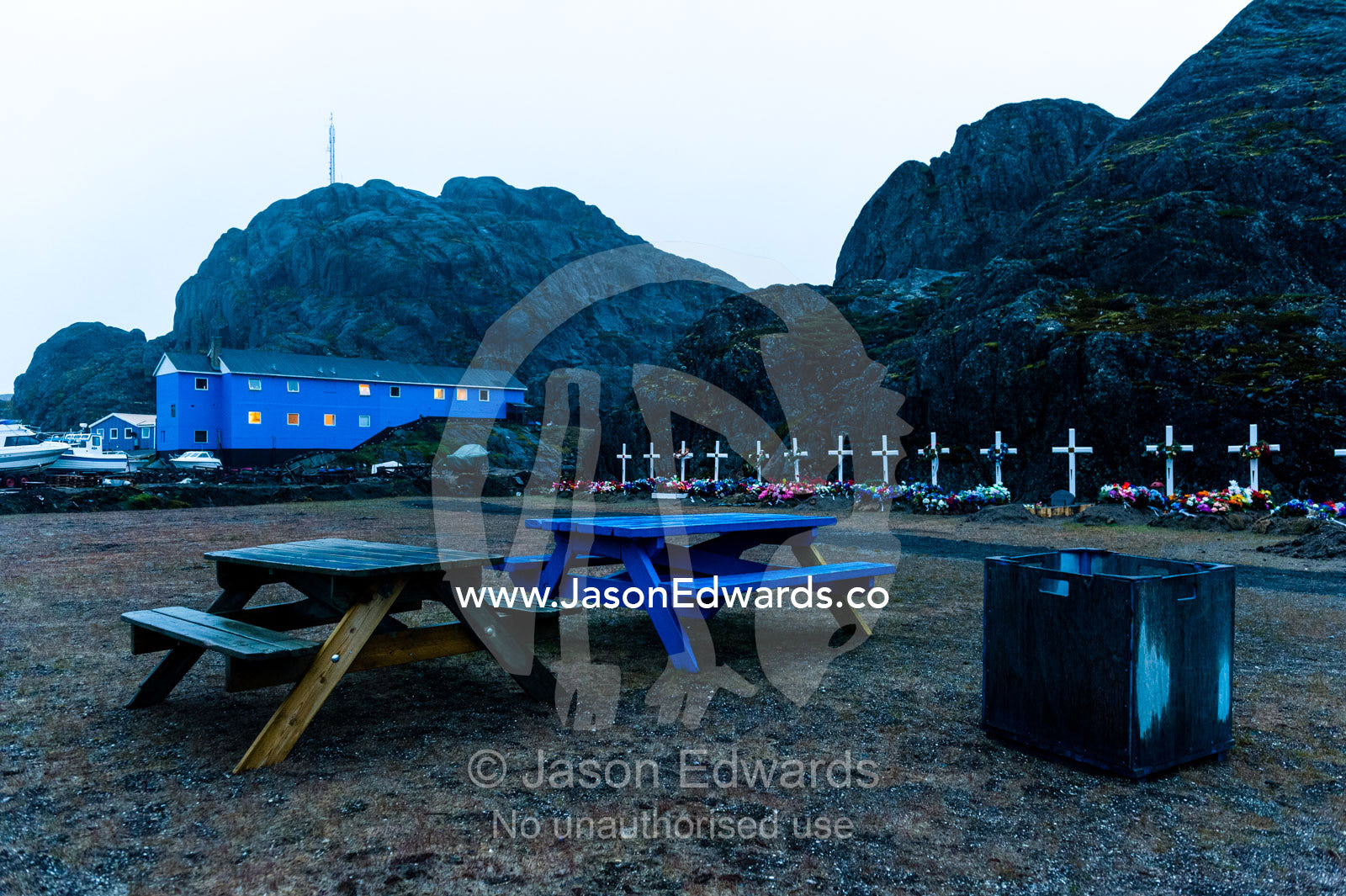 Picnic tables and garbage bins in a fishing village cemetery. Maniitsoq, Sukkertoppen, Qeqqata Municipality, Greenland.