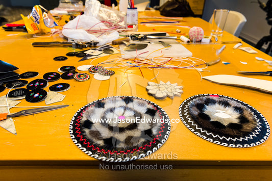 Tools and glue are used to sew seal pelts together to create artwork, souvenirs and home accessories. Kangaamiut, Gammel Sukkertoppen, Qeqqata Municipality, Greenland.