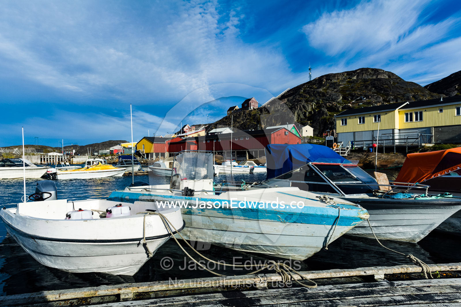 Fishing and recreational boats moored in a fishing town port. Kangaamiut, Gammel Sukkertoppen, Qeqqata Municipality, Greenland.