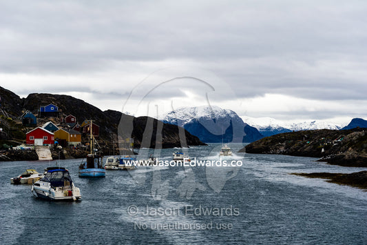An arctic fishing community perched on a rugged, barren island. Kangaamiut, Gammel Sukkertoppen, Qeqqata Municipality, Greenland.