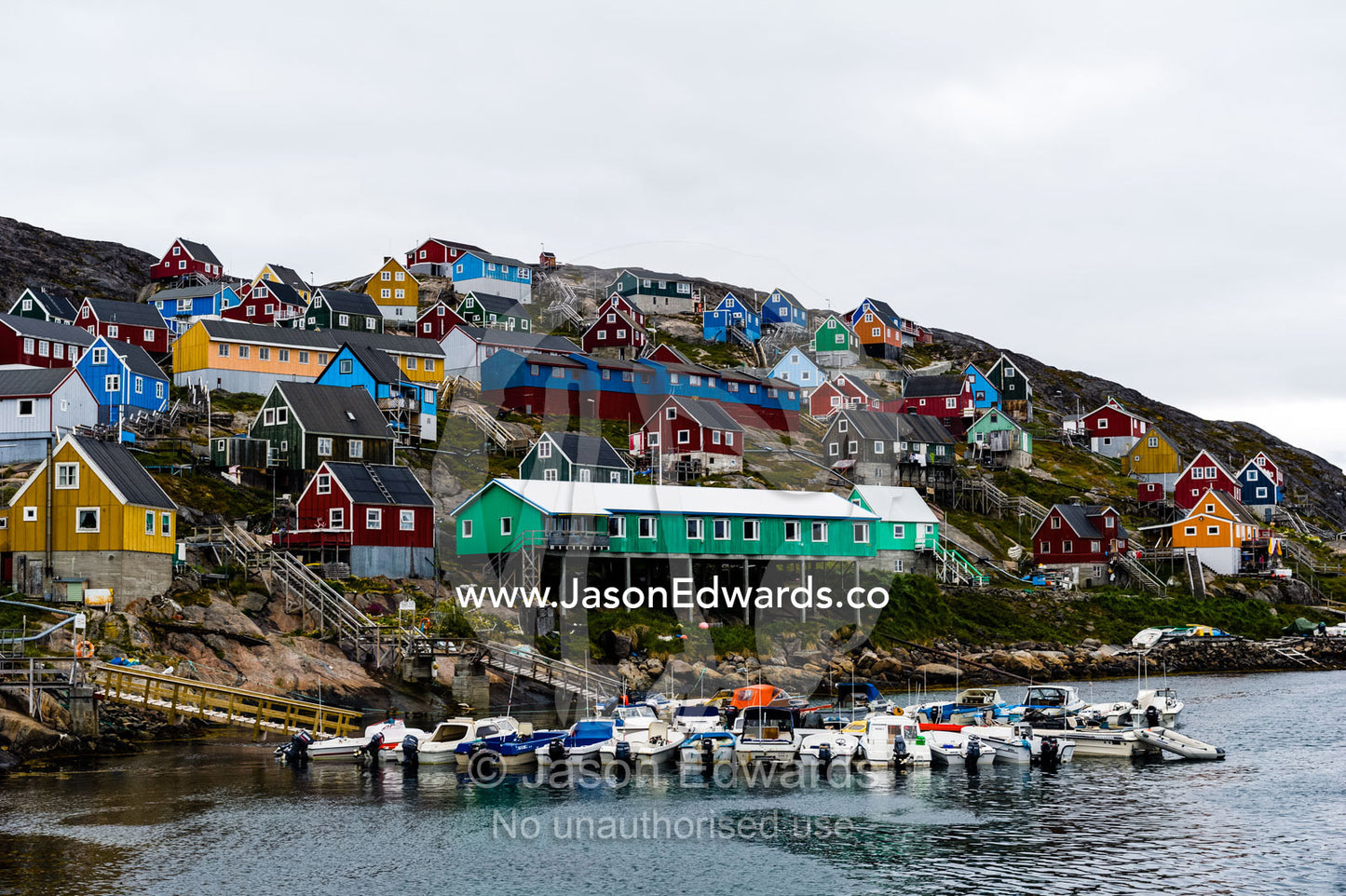 An arctic fishing community perched on a rugged, barren island. Kangaamiut, Gammel Sukkertoppen, Qeqqata Municipality, Greenland.