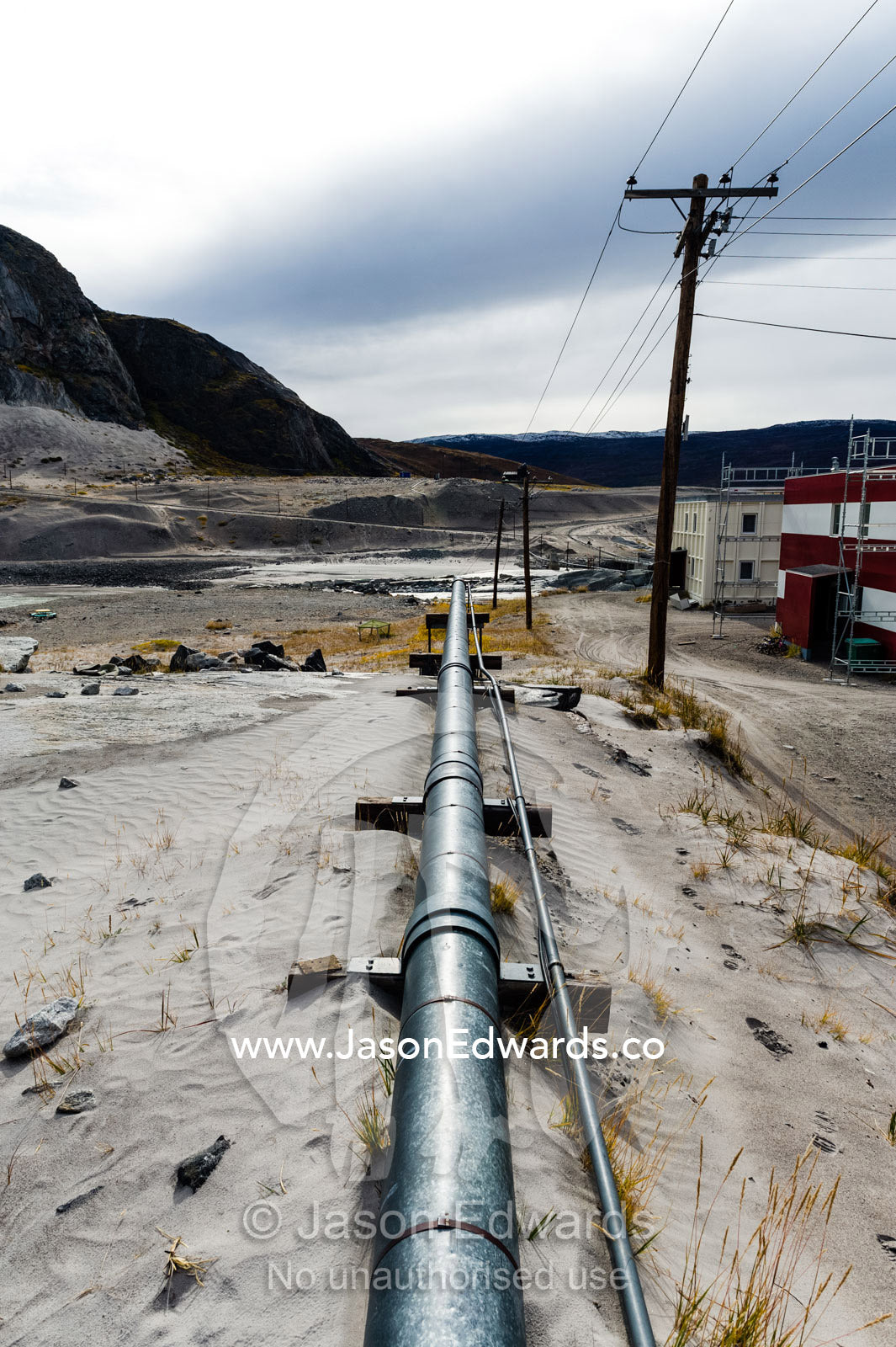 A pipeline supplies gas to an arctic village to heat homes. Kangerlussuaq, Qeqqata Municipality, Greenland.