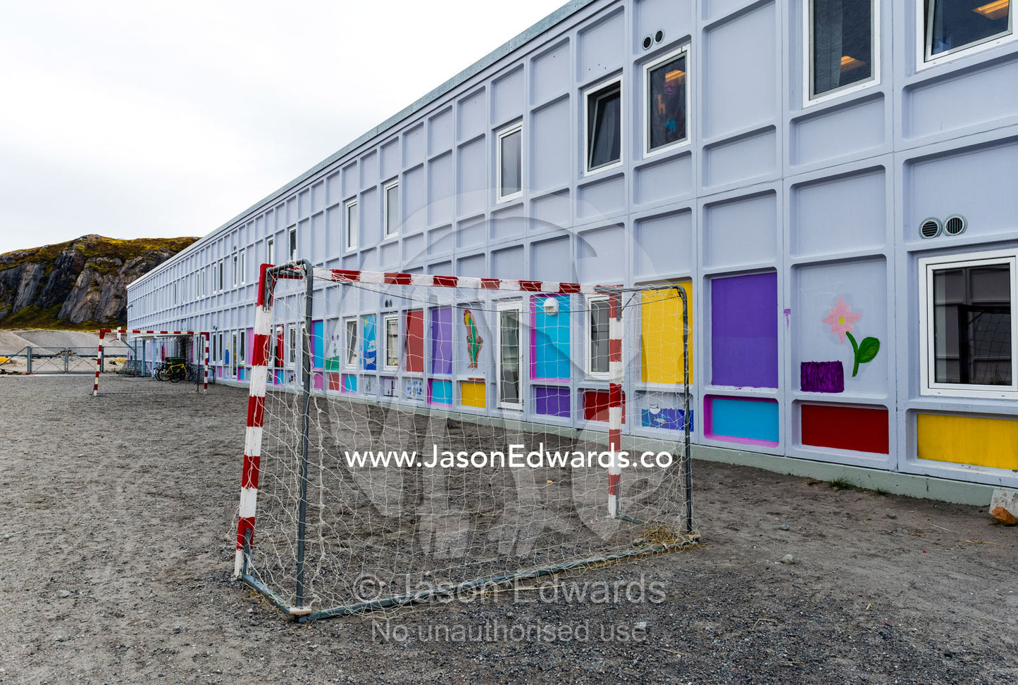 Soccer goal posts in the playground of an elementary school in an arctic village. Kangerlussuaq, Qeqqata Municipality, Greenland.