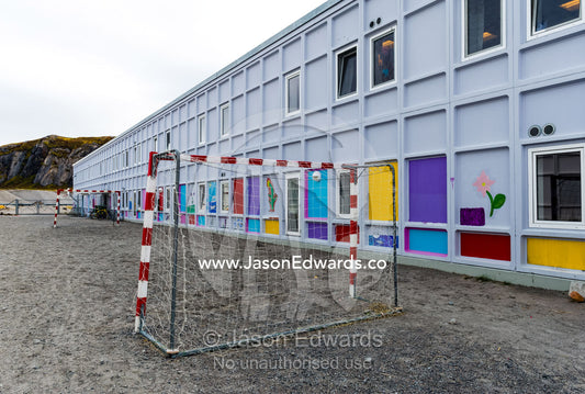 Soccer goal posts in the playground of an elementary school in an arctic village. Kangerlussuaq, Qeqqata Municipality, Greenland.