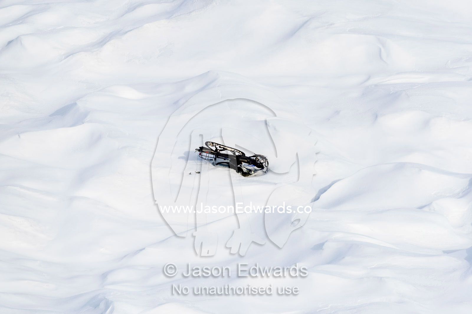 A damaged skiddoo turned upside down on the Greenland Ice Sheet. Greenland Ice Sheet, Qeqqata Municipality, Kangerlussuaq, Greenland.