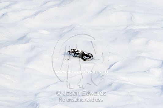 A damaged skiddoo turned upside down on the Greenland Ice Sheet. Greenland Ice Sheet, Qeqqata Municipality, Kangerlussuaq, Greenland.