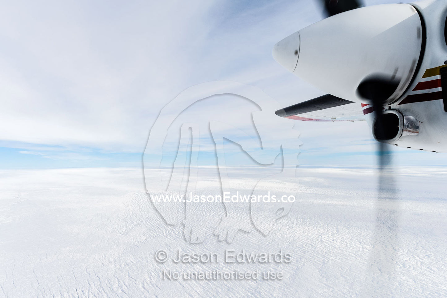 The propeller of a small plane flying over the Greenland Ice Sheet. Greenland Ice Sheet, Qeqqata Municipality, Kangerlussuaq, Greenland.